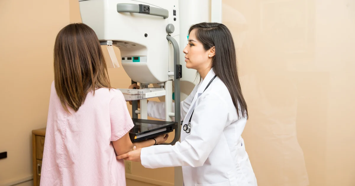 Woman undergoing an annual mammogram in Dallas Tx for early breast cancer detection