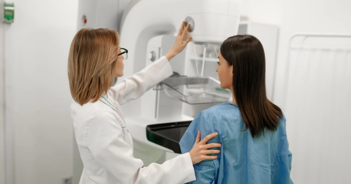 The Painless Mammogram Dallas technologist reviewing 3D breast scans.